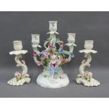 Continental porcelain floral encrusted candelabra (a/f) together with a pair of candlesticks,