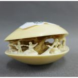 Late 19th / early 20th century Japanese carved ivory clam shell, signed to the base, 8cm long