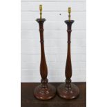 A pair of modern mahogany table lamp bases, 70cm (2)