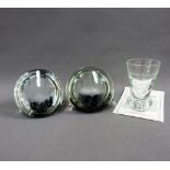 Two Caithness glass limited edition paperweights and a Caithness whisky dram glass, (3)