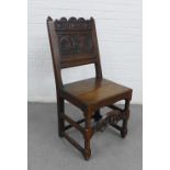 Dark oak Wainscott style chair with carved back, solid seat and bobbin front legs, 98 x 47cm