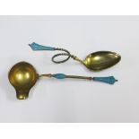 Norwegian style silver gilt and enamel spoon with a looped stem together with a matching ladle, both