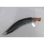 Nepali Kukri, in a black leather scabbard, approx 45cm