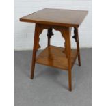 An oak side table, the top inlaid with a geometric motif, raised on Gothic side supports with an