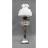 Oil lamp with an Epns base, clear glass well and white opaque glass shade, overall height 62cm