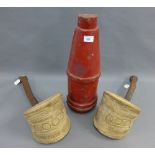 A pair of large carved wooden stirrups and a red painted wooden mould, tallest 52cm high