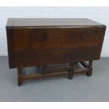 Dark oak drop leaf table with a single drawer to one end, 127 x 110cm