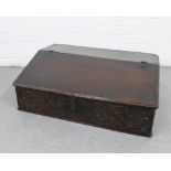 Late 18th century carved oak Bible box, with hinged and slanted top with a void interior, 48 x 72cm