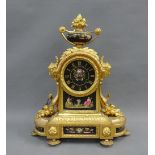 Louis XVI style gilt metal mantle clock, the circular dial surmounted by an urn with flowers,