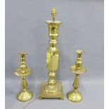 A pair of brass candlesticks together with a large brass knop stemmed table lamp base, 65cm high (