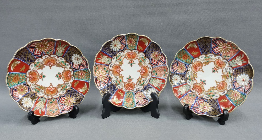 Set of three Chinese scalloped edge dishes, painted with butterfly, flowers and foliage pattern,