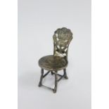 Miniature silver chair, a Kwang Tung Province coin forming the seat, makers mark WS, 4cm high