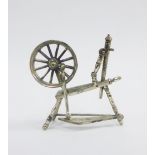 Miniature silver spinning wheel, stamped 925, 4cm high