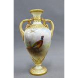 Royal Worcester porcelain two handled vase, handpainted with a pheasant , within gilt acanthus