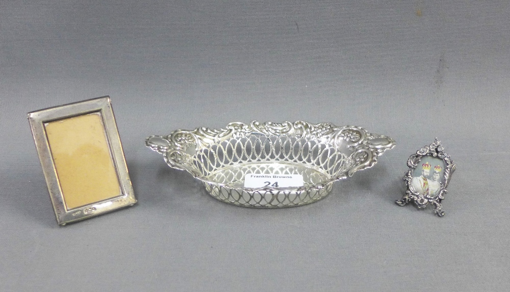 Silver bonbon basket, Birmingham 1901 and two small silver photograph frames, smallest 3cm, (3)