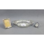 Silver bonbon basket, Birmingham 1901 and two small silver photograph frames, smallest 3cm, (3)