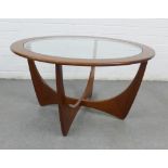 Vintage Astro teak and glass coffee table, with circular top and cross stretcher base, in the manner