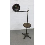 Early 20th century washstand with a cast metal base, oak shelf and circular mirror, 125cm high