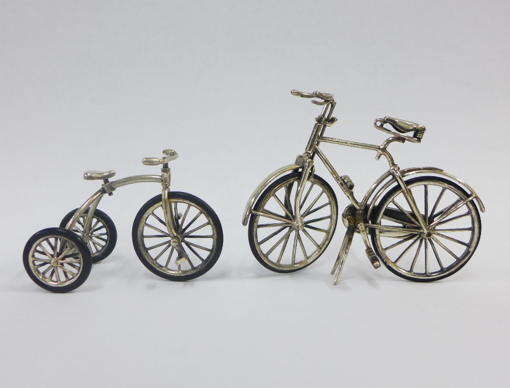 Miniature silver bicycle together with a silver tricycle, both stamped 925, tallest 6cm (2)