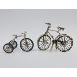 Miniature silver bicycle together with a silver tricycle, both stamped 925, tallest 6cm (2)