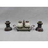 Bronze desk inkstand with two glass inkwells together with a pair of bronze candlesticks, tallest