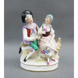 Small porcelain male and female figure group with gold anchor mark, 12cm high