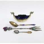 Silver Viking boat salt with a blue glass liner, Birmingham 1955 together with a silver gilt and