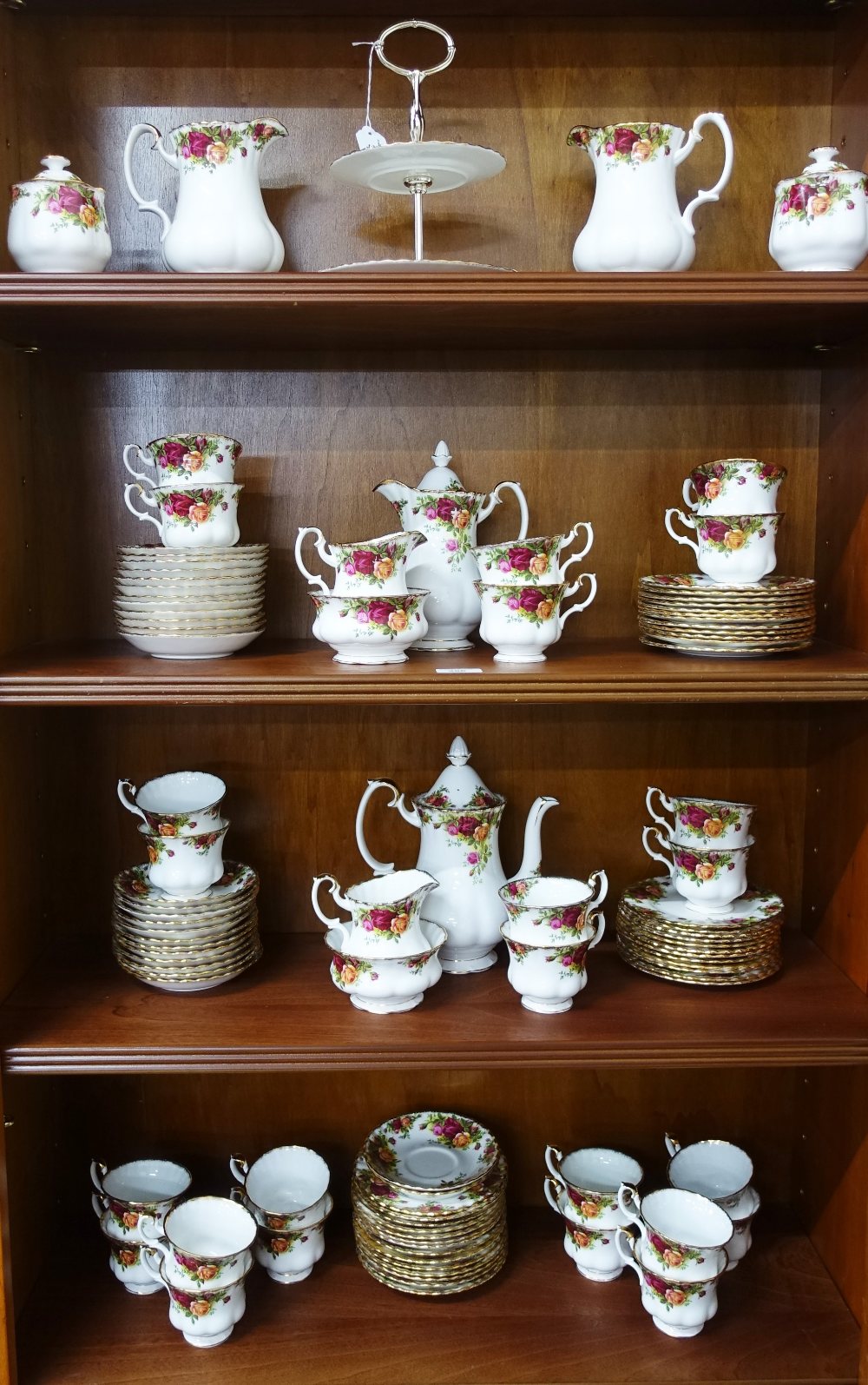 An extensive Royal Albert Old Country Roses teaset comprising cups, saucers, side plates, two tier