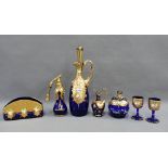 A collection of blue coloured Bohemian glass with enamelled flowers and gilt highlights to include a