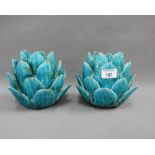 A pair of turquoise glazed 'lotus' candlesticks, 15cm high (2)