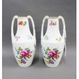A pair of Rosenthal white glazed vases with mixed flower pattern and gilt edged rims, handles to