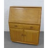 Ercol Golden Dawn, Windsor range bureau, with fall front over a single drawer and pair of cupboard