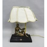 Art Deco figural table lamp on a stepped rectangular base, complete with its original shade,