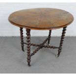 19th century table, with an oval top with starburst veneers, on bobbin legs and stretcher, ceramic