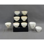 Collection of ten English porcelain tea bowls, white glazed with gilt borders, (10)