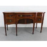 George III style mahogany and satinwood serpentine sideboard, with an arrangement of five drawers