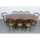 Indian rosewood and brass inlaid twin pedestal dining table and a matched group of eight mahogany