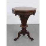 Early 19th century rosewood sewing table, the octagonal top opening to reveal a fitted interior , on