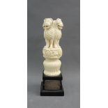 Early 20th century ivory figure group with four lions, on an ebonised plinth base with a white metal