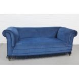 Early 20th century drop end sofa with blue velvet upholstery, on mahogany legs with brass caps and
