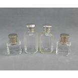 Pair of late Victorian silver topped glass bottle, 9cm high and a pair of smaller bottles with