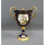 Coalport porcelain vase, with three gilt loop handles and handpainted bird pattern panels to a