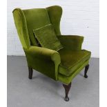 Wing arm chair with green velvet upholstery, on cabriole legs, 98 x 80cm