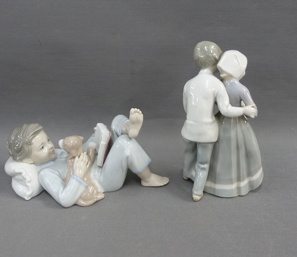 Lladro figure of a boy, modelled lying down and reading with his puppy, 18cm, together with - Image 2 of 3