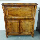 Walnut bureau, the fall front with a fitted interior over a pair of cupboard doors, 122 x 106 x 54cm