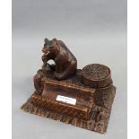 Black Forest style carved wooden bear desk tidy with pen tray, 17 x 12cm