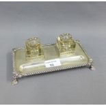 Silver desk inkstand, the rectangular base with two glass inkwells with silver shell covers, with