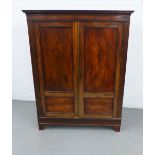 19th century mahogany wardrobe, of small proportions, with dentil cornice over a pair of cupboard