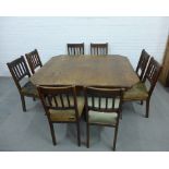 Late 19th / early 20th century oak extending dining table with a matched set of eight chairs, John