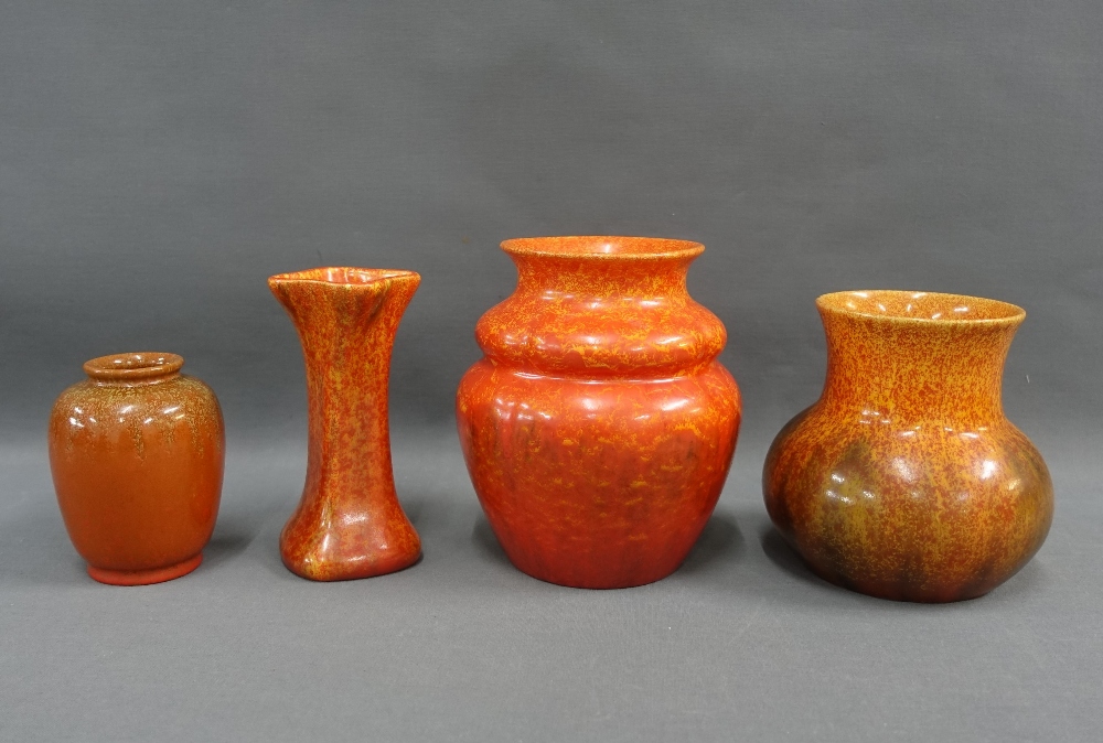 A collection of Pilkingtons Royal Lancastrian orange glazed pottery to include four vases of various